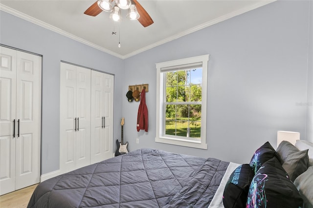 6330 Oil Well Rd, Clermont, FL 34714 - bedroom with crown molding, ceiling fan, wood finished floors, multiple closets, and baseboards