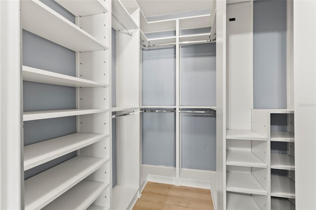 6330 Oil Well Rd, Clermont, FL 34714 - spacious closet with wood finished floors