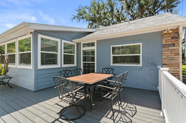 6330 Oil Well Rd, Clermont, FL 34714 - wooden terrace with outdoor dining area
