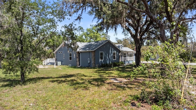 6330 Oil Well Rd, Clermont, FL 34714 - exterior space with a yard and central AC unit