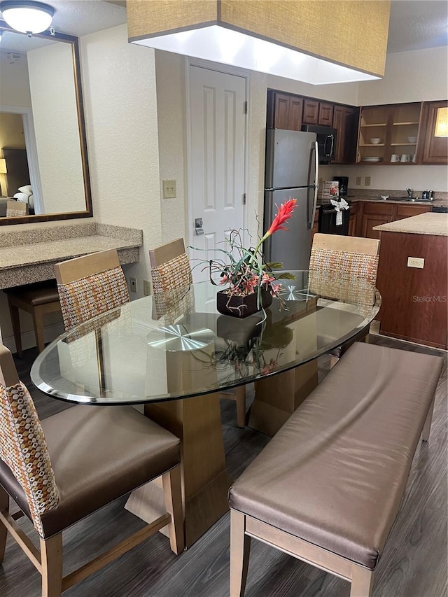 12527 Floridays Resort Dr Unit 311E, Orlando, FL 32821 - dining space with dark wood-style flooring