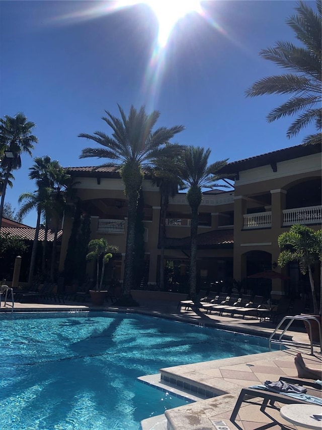 12527 Floridays Resort Dr Unit 311E, Orlando, FL 32821 - community pool with a patio