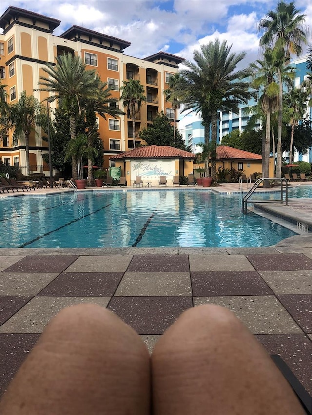 12527 Floridays Resort Dr Unit 311E, Orlando, FL 32821 - community pool with a patio area