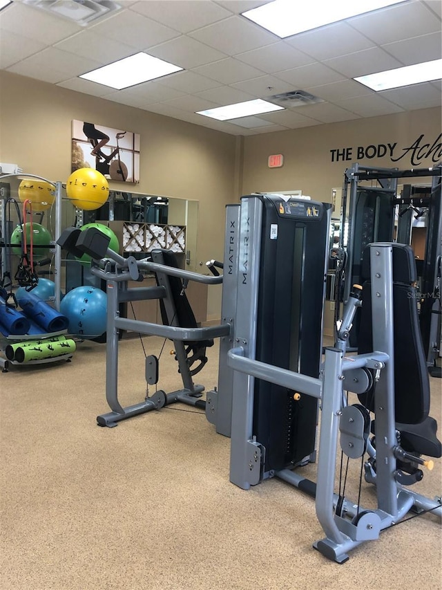 12527 Floridays Resort Dr Unit 311E, Orlando, FL 32821 - gym featuring a paneled ceiling, carpet flooring, and visible vents