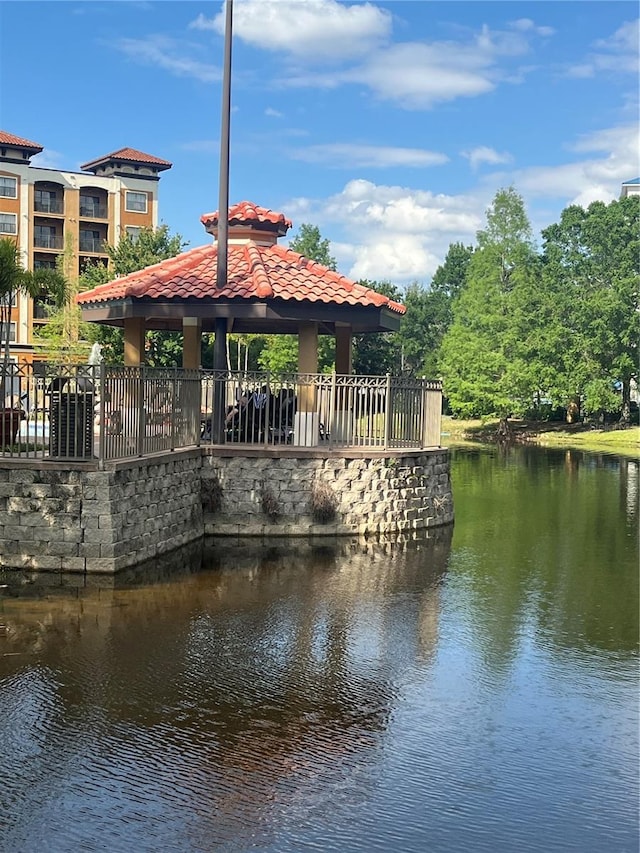 12527 Floridays Resort Dr Unit 311E, Orlando, FL 32821 - view of dock with a gazebo and a water view