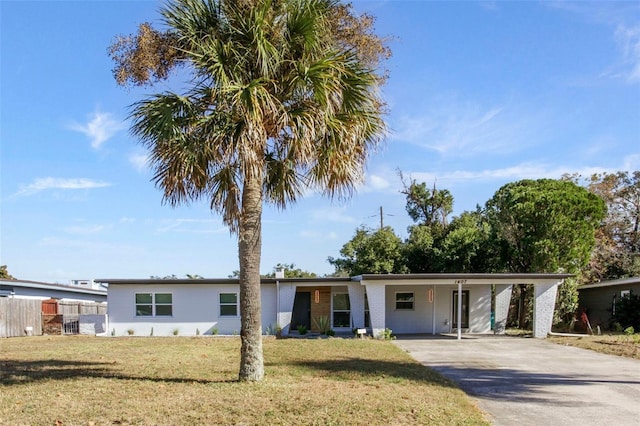 view of front of property featuring an attached carport, a front yard, driveway, and fence