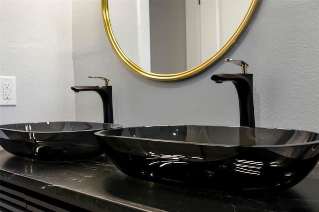room details with a textured wall and a sink