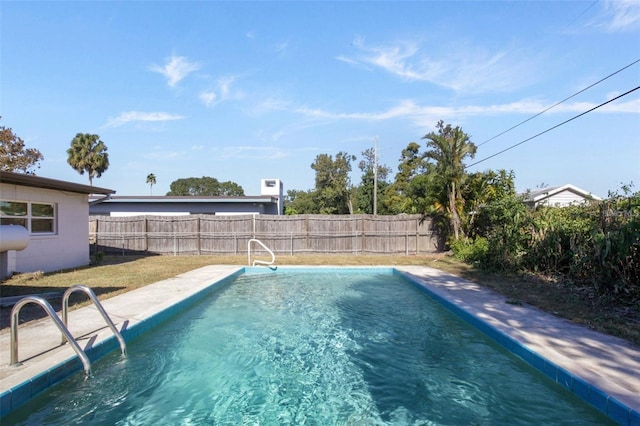 view of swimming pool featuring a fenced backyard and a fenced in pool