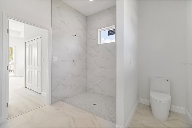 2551 Alhaven Ter, North Port, FL 34286 - bathroom featuring toilet, a tile shower, marble finish floor, and baseboards