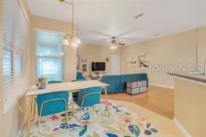 5005 Cape Hatteras Dr, Clermont, FL 34714 - interior space featuring baseboards, blue cabinetry, and ceiling fan