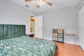 5005 Cape Hatteras Dr, Clermont, FL 34714 - bedroom with visible vents, ceiling fan, baseboards, and wood finished floors