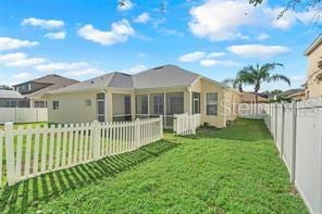 5005 Cape Hatteras Dr, Clermont, FL 34714 - rear view of house featuring a yard and a fenced backyard