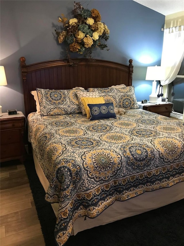 bedroom with wood finished floors