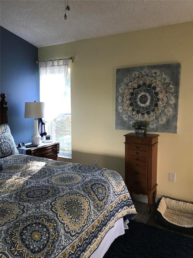 bedroom featuring a textured ceiling