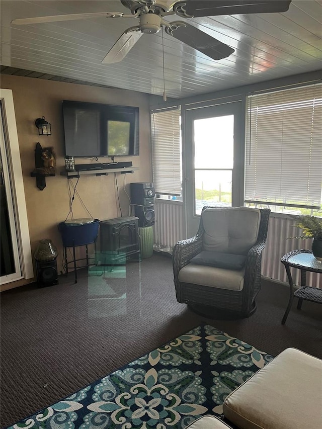 sunroom featuring ceiling fan