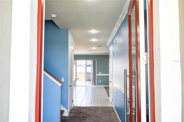 184 Lake Smart Cir, Winter Haven, FL 33881 - corridor featuring crown molding, baseboards, carpet floors, tile patterned floors, and recessed lighting