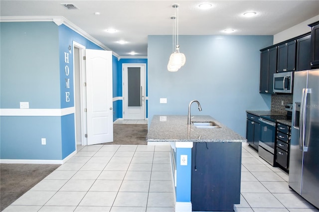 184 Lake Smart Cir, Winter Haven, FL 33881 - kitchen with stainless steel appliances, a sink, light stone countertops, backsplash, and a kitchen island with sink