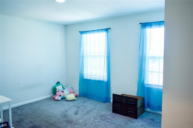 184 Lake Smart Cir, Winter Haven, FL 33881 - playroom with carpet flooring and healthy amount of natural light