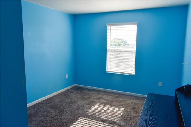 184 Lake Smart Cir, Winter Haven, FL 33881 - spare room with carpet and baseboards