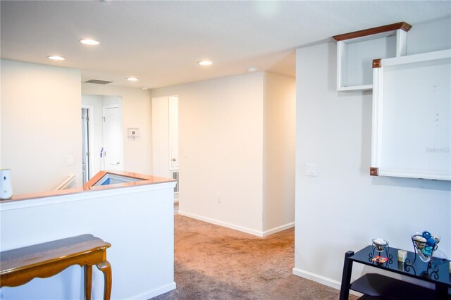 184 Lake Smart Cir, Winter Haven, FL 33881 - hallway with light carpet, recessed lighting, and baseboards