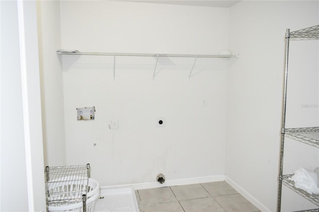 184 Lake Smart Cir, Winter Haven, FL 33881 - laundry area with hookup for an electric dryer, washer hookup, light tile patterned floors, and baseboards