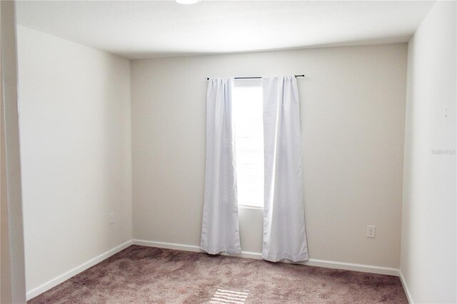 184 Lake Smart Cir, Winter Haven, FL 33881 - unfurnished room with light colored carpet and baseboards