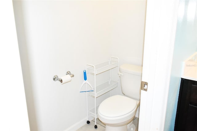 184 Lake Smart Cir, Winter Haven, FL 33881 - bathroom featuring toilet, baseboards, and tile patterned floors