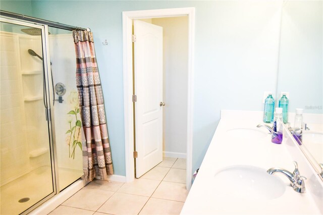 184 Lake Smart Cir, Winter Haven, FL 33881 - full bath with a shower stall, tile patterned floors, baseboards, and double vanity