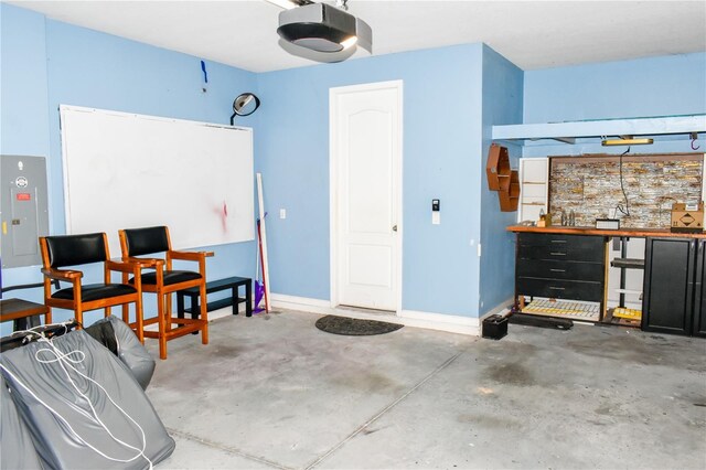 184 Lake Smart Cir, Winter Haven, FL 33881 - garage with a garage door opener, electric panel, and baseboards