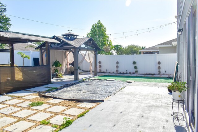 184 Lake Smart Cir, Winter Haven, FL 33881 - view of patio / terrace featuring a gazebo and a fenced backyard