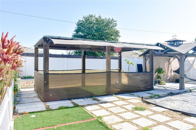 184 Lake Smart Cir, Winter Haven, FL 33881 - exterior space featuring a hot tub, a fenced backyard, and a gazebo