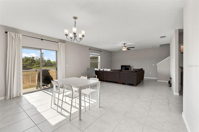 dining room with visible vents, baseboards, and ceiling fan with notable chandelier