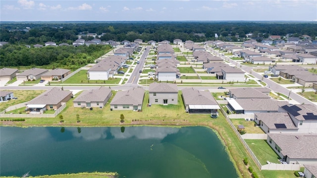 drone / aerial view with a residential view and a water view