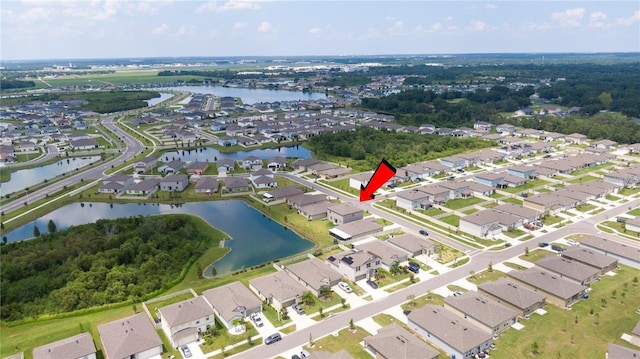 birds eye view of property with a residential view and a water view