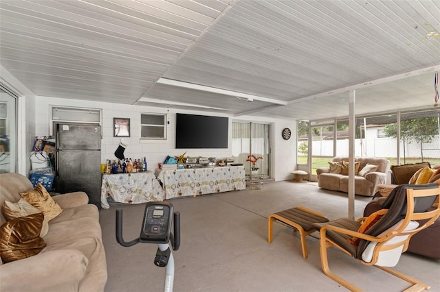 living area with wooden ceiling