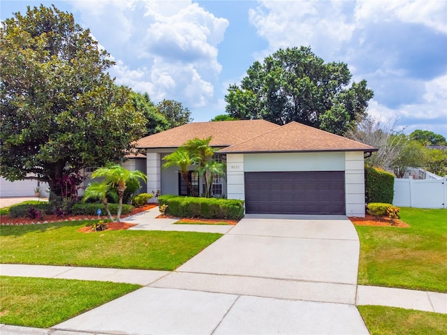 8023 Canyon Lake Cir, Orlando, FL 32835 - ranch-style house featuring a garage, driveway, stucco siding, and roof with shingles