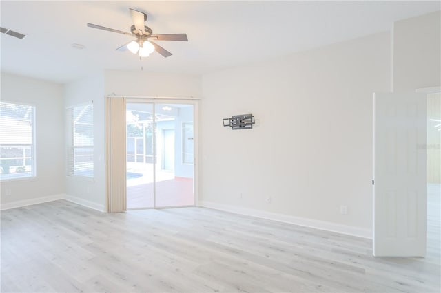 8023 Canyon Lake Cir, Orlando, FL 32835 - spare room with light wood finished floors and plenty of natural light