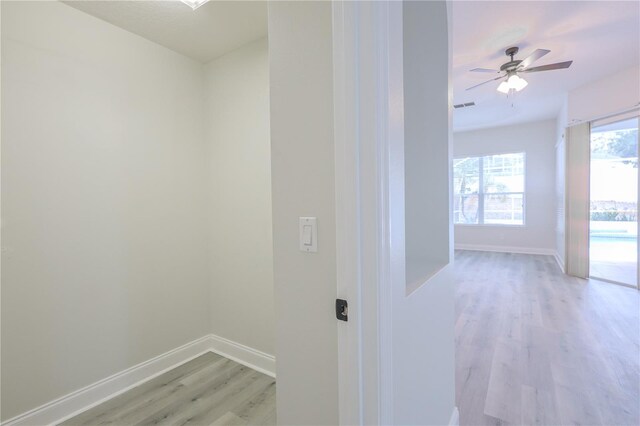 8023 Canyon Lake Cir, Orlando, FL 32835 - hall featuring light wood finished floors and baseboards
