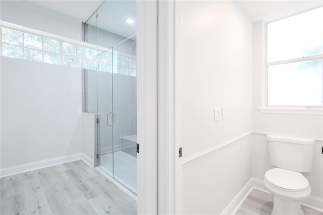 8023 Canyon Lake Cir, Orlando, FL 32835 - full bath featuring wood finished floors, a stall shower, healthy amount of natural light, and toilet