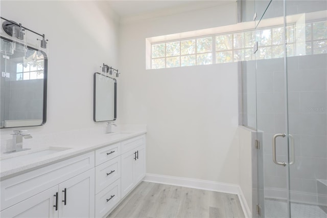 8023 Canyon Lake Cir, Orlando, FL 32835 - full bathroom with healthy amount of natural light, a shower stall, wood finished floors, and double vanity
