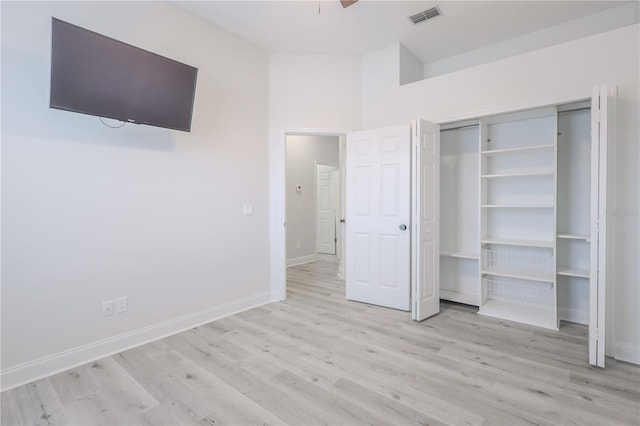 8023 Canyon Lake Cir, Orlando, FL 32835 - unfurnished bedroom featuring wood finished floors, baseboards, and a closet