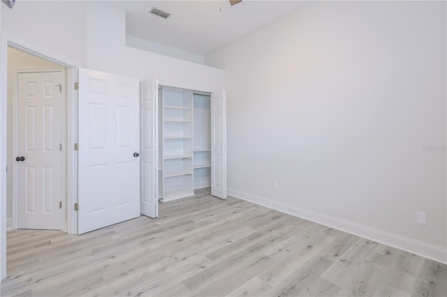 8023 Canyon Lake Cir, Orlando, FL 32835 - unfurnished bedroom featuring light wood-type flooring, baseboards, a closet, and ceiling fan