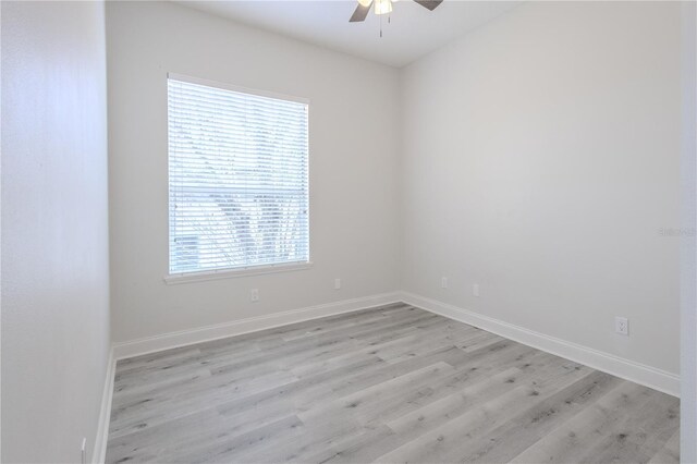 8023 Canyon Lake Cir, Orlando, FL 32835 - spare room with a ceiling fan, light wood-type flooring, and baseboards