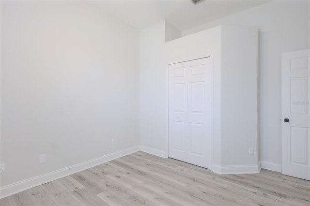 8023 Canyon Lake Cir, Orlando, FL 32835 - unfurnished bedroom with light wood finished floors and baseboards