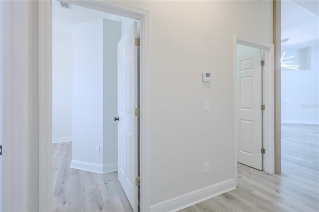 8023 Canyon Lake Cir, Orlando, FL 32835 - hall featuring light wood finished floors and baseboards