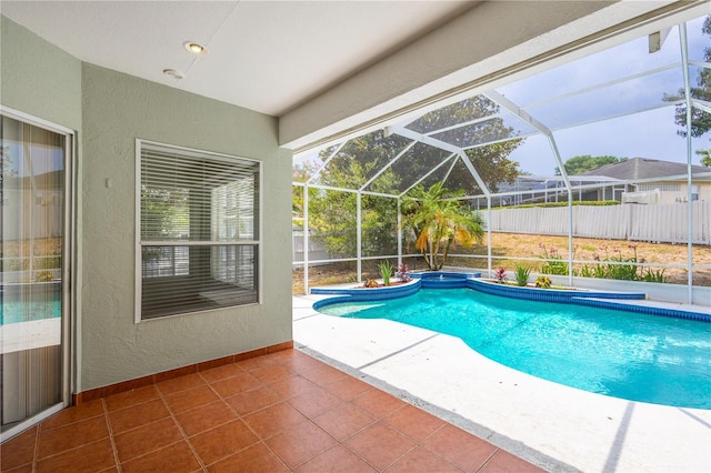 8023 Canyon Lake Cir, Orlando, FL 32835 - view of pool featuring a patio, a fenced backyard, a pool with connected hot tub, and glass enclosure