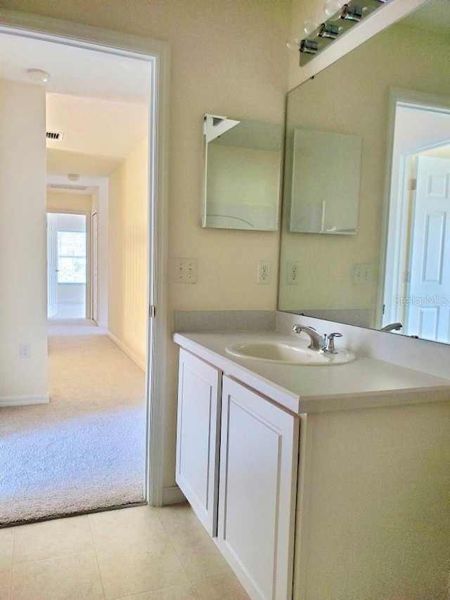 bathroom with visible vents, tile patterned floors, and vanity
