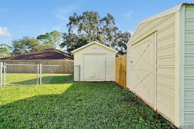 view of shed with a fenced backyard