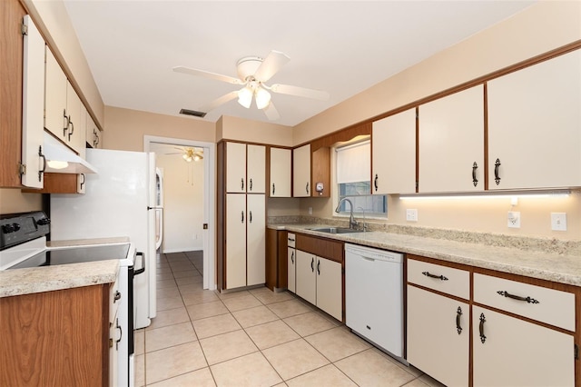 kitchen featuring ceiling fan, dishwasher, light countertops, a sink, and electric range oven