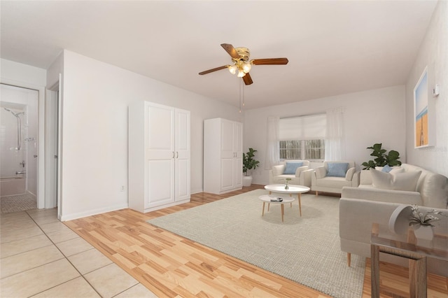 1432 Meadowlark Dr, Deltona, FL 32725 - living room with a ceiling fan, light wood-type flooring, and baseboards